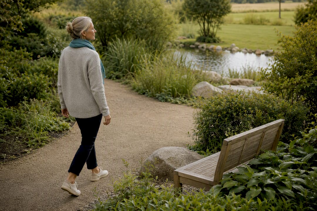 An adult walks calmly through a therapy garden.